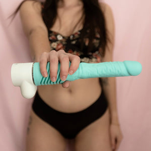 woman-holding-thrusting-dildo